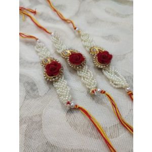 Pearls Rakhi, golden design with red rose, pearls chain with cotton thread